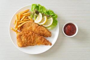 Homemade Breaded Weiner Schnitzel with Potato Chips photo