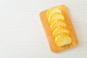 potatoes bread sliced on wood board photo