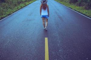 Asian women travel relax in the holiday. walk on the road photo