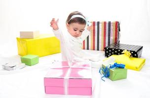 Baby girl with gifts photo