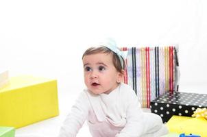 Baby girl with gifts photo