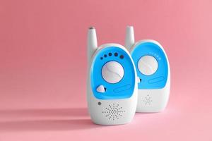 Baby monitor units on color background. Radio nanny photo