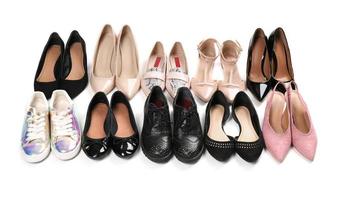 Various female stylish shoes on white background photo