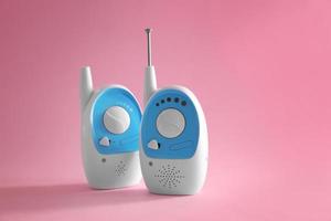 Baby monitor units on color background. Radio nanny photo