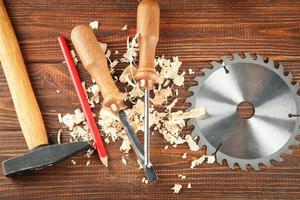 Set of carpenter's tools on wooden background photo