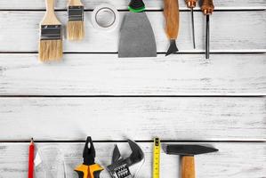 Set of tools on wooden background photo