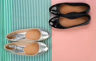 Stylish female shoes on color background photo