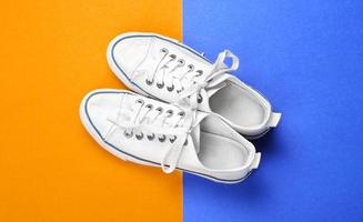 Casual female shoes on color background photo