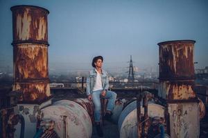 Urban man with hat against the background of city photo