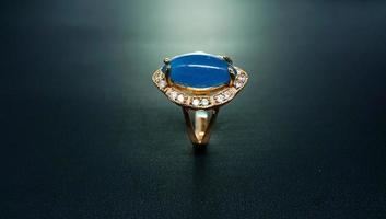 photo of women's ring with a light blue stone motif