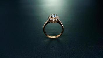 Photo of a small floral diamond ring with a black background