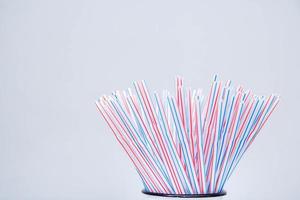 Drinking plastic straws on a gray background photo