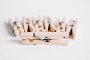 Set of clothespins on white background photo