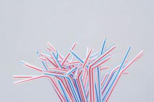Drinking plastic straws on a gray background photo