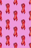 día internacional del sida. cinta roja con una dura sombra sobre un fondo rosa. concepto de concienciación sobre el sida. vertical. patrón