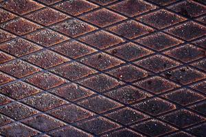 Texture of rusty metal surface with rhombic shapes photo