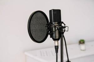 Professional studio microphone on a modern tripod photo