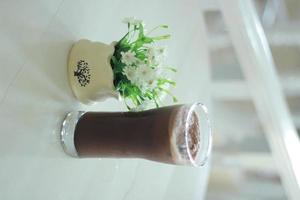 cold chocolate drink on the table photo