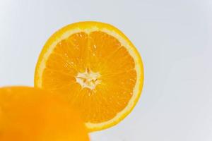 Orange and orange slice on a white background photo