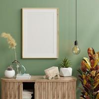 Interior poster mockup with vertical wooden frame on wooden cabinet and green wall. photo