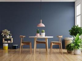 Modern dining room interior design with dark blue wall. photo