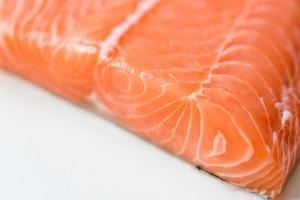 Fresh salmon fish, Close up raw salmon filet seafood for sashimi or steak photo