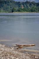 A wooden canoe on the river bank photo