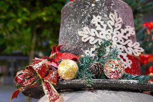 Close up decoration Christmas ball, ribbon at hat photo