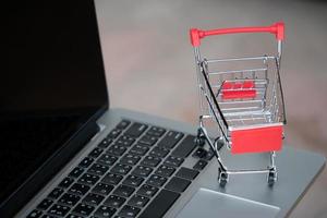 shopping cart on laptop photo