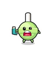 lollipop mascot having asthma while holding the inhaler vector