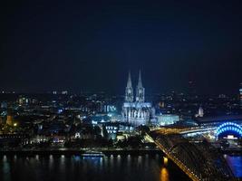 Aerial night view of St Peter Cathedral and Hohenzollern Bridge photo