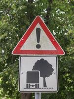 Street sign with trees photo