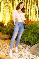 Asian female portrait with lights at night photo