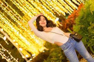 Asian female portrait with lights at night photo