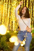 Asian female portrait with lights at night photo