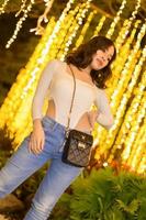 Asian female portrait with lights at night photo