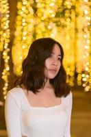 Asian female portrait with lights at night photo