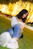 Asian female portrait with lights at night photo