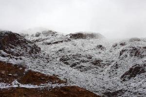 Franklin Mountains on the Westside of El Paso, Texas, covered in snow looking towards Trans Mountain Road photo