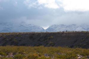 Franklin Mountains on the Westside of El Paso, Texas, covered in snow looking towards Trans Mountain Road photo