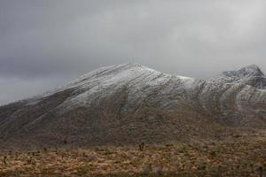 Franklin Mountains on the Westside of El Paso, Texas, covered in snow looking towards Trans Mountain Road photo