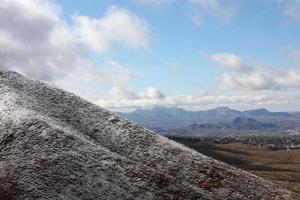 Franklin Mountains on the Westside of El Paso, Texas, covered in snow looking towards Trans Mountain Road photo