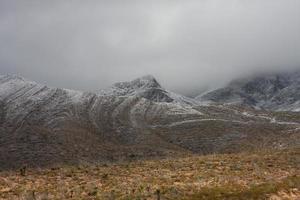 Franklin Mountains on the Westside of El Paso, Texas, covered in snow looking towards Trans Mountain Road photo