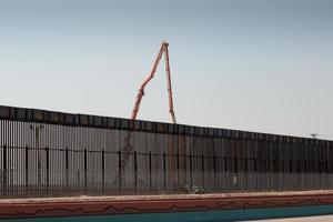 Fence along the US, Mexican border in El Paso, Texas photo