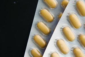 Close up of pills of blister pack on table photo