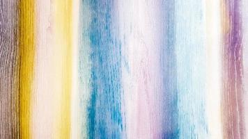 Textured wooden background painted in different colors of the rainbow. Colorful colored abstract background. photo