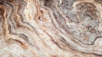 The surface of Sandstone with wavy brown veins. Sulphide agate texture. Wide image of brown natural stone texture Sphalerite. Beautiful wavy pattern of cut of Schalenblende stone close-up photo