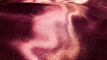 violet fabric close up background. Smooth elegant silk or satin texture can be used as background. Abstract drapery fabric, weave of fabric background photo