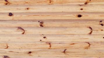 Brown rustic wood texture background. Natural background pattern from a log wall. Facade of a log house, copy space. A board with lots of horizontal wooden logs. photo