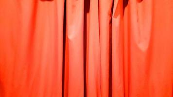 Red curtain use for background. Silk Cloth Background, Red Satin Fabric Waves, Abstract Texture. Red concert curtain full of folds photo